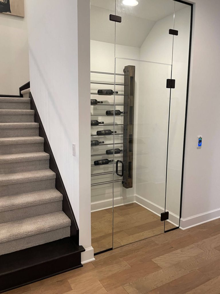 Wine Pantry with clear glass door and wall